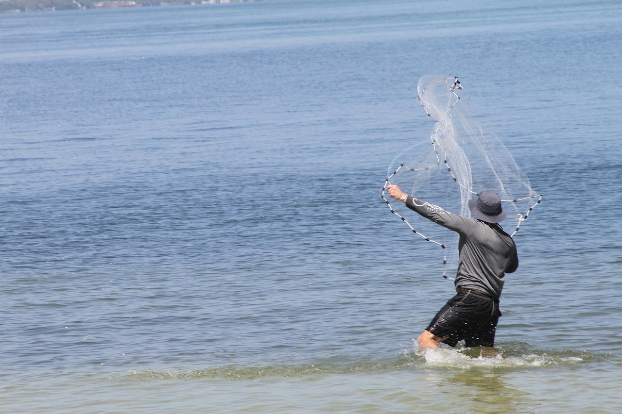 person casting fishing line person casting fishing line