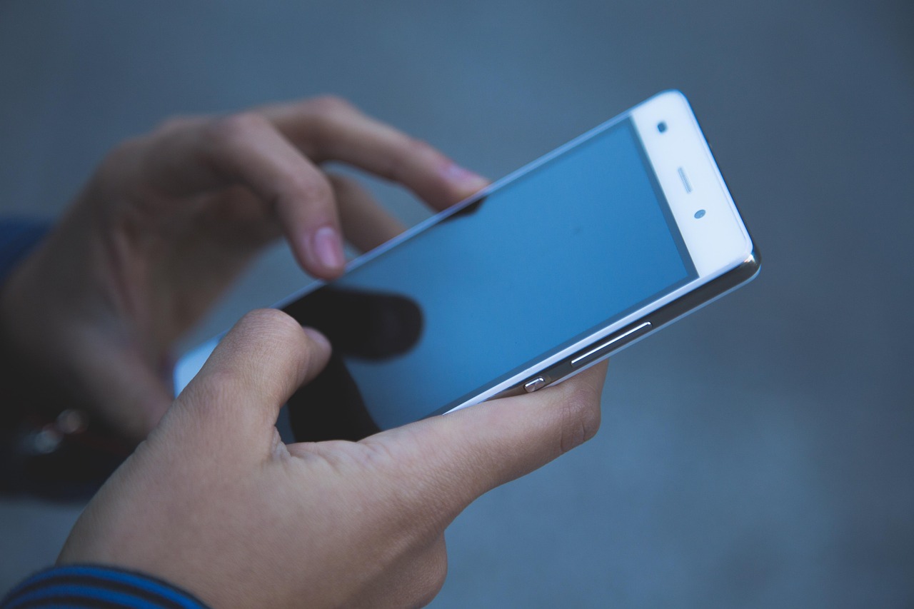 person using smartphone person using smartphone