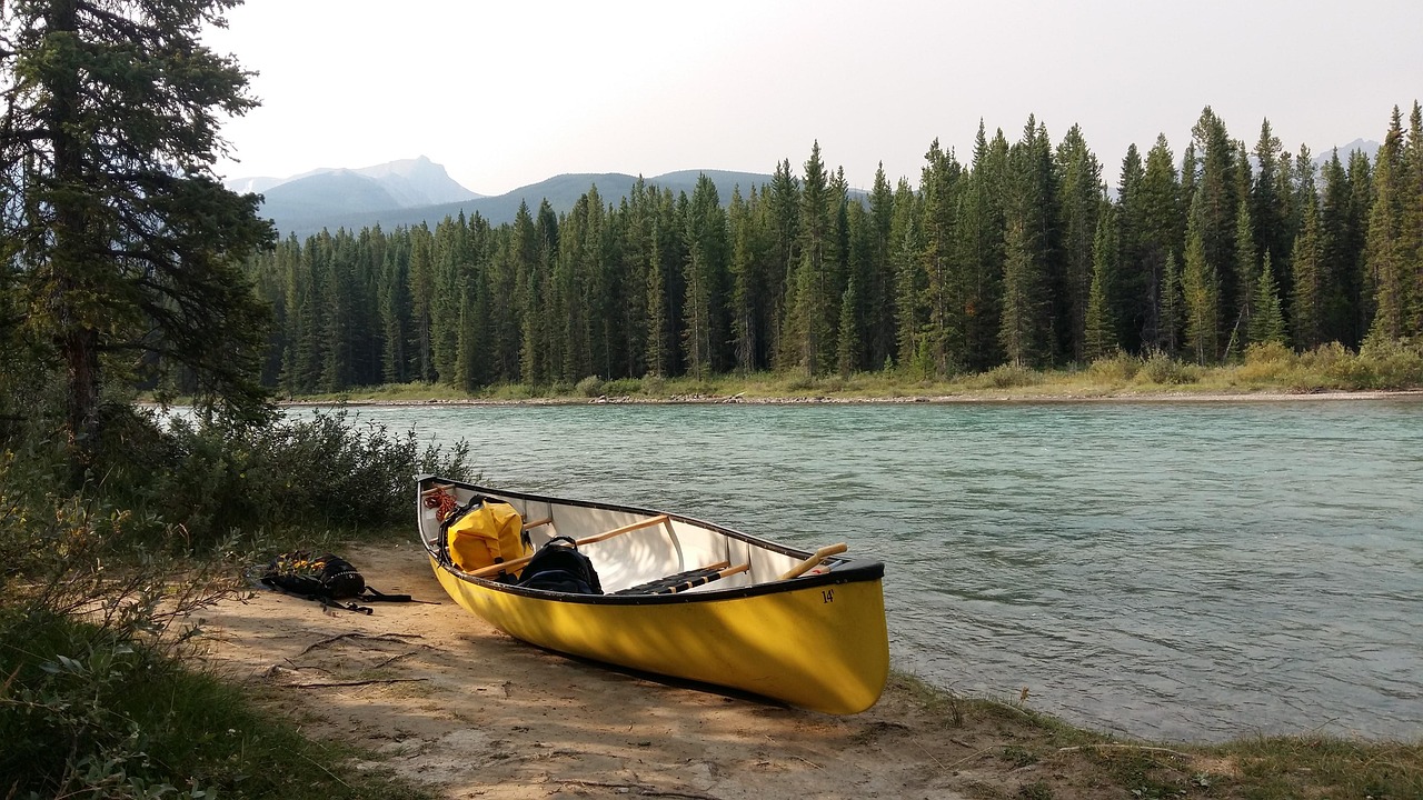 person carrying canoe person carrying canoe