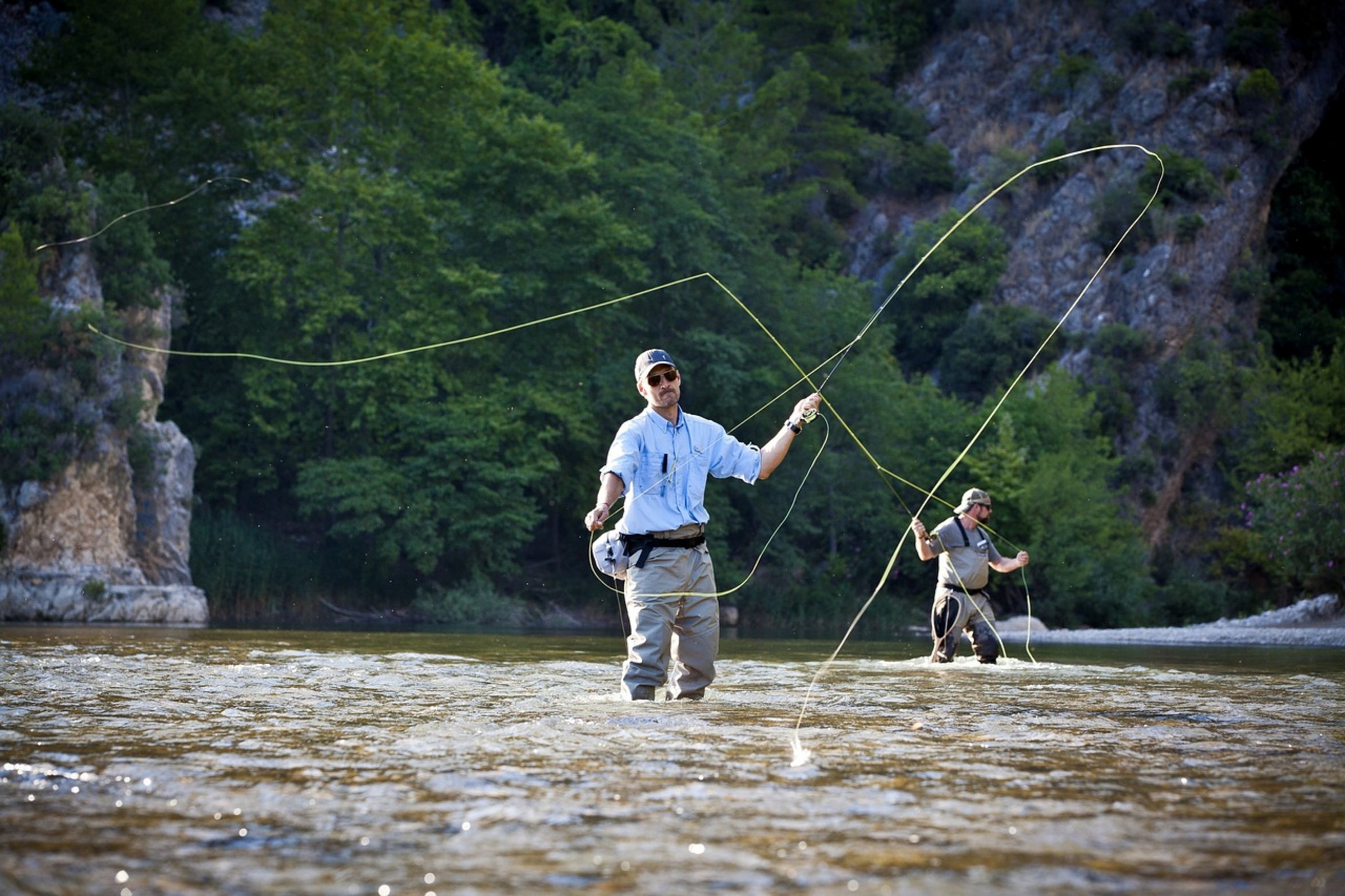 angler in dark clothes river angler in dark clothes river